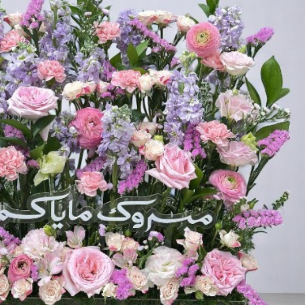 Exquisite bouquet of soft pink and purple flowers, perfect for celebrating the arrival of a newborn baby girl.